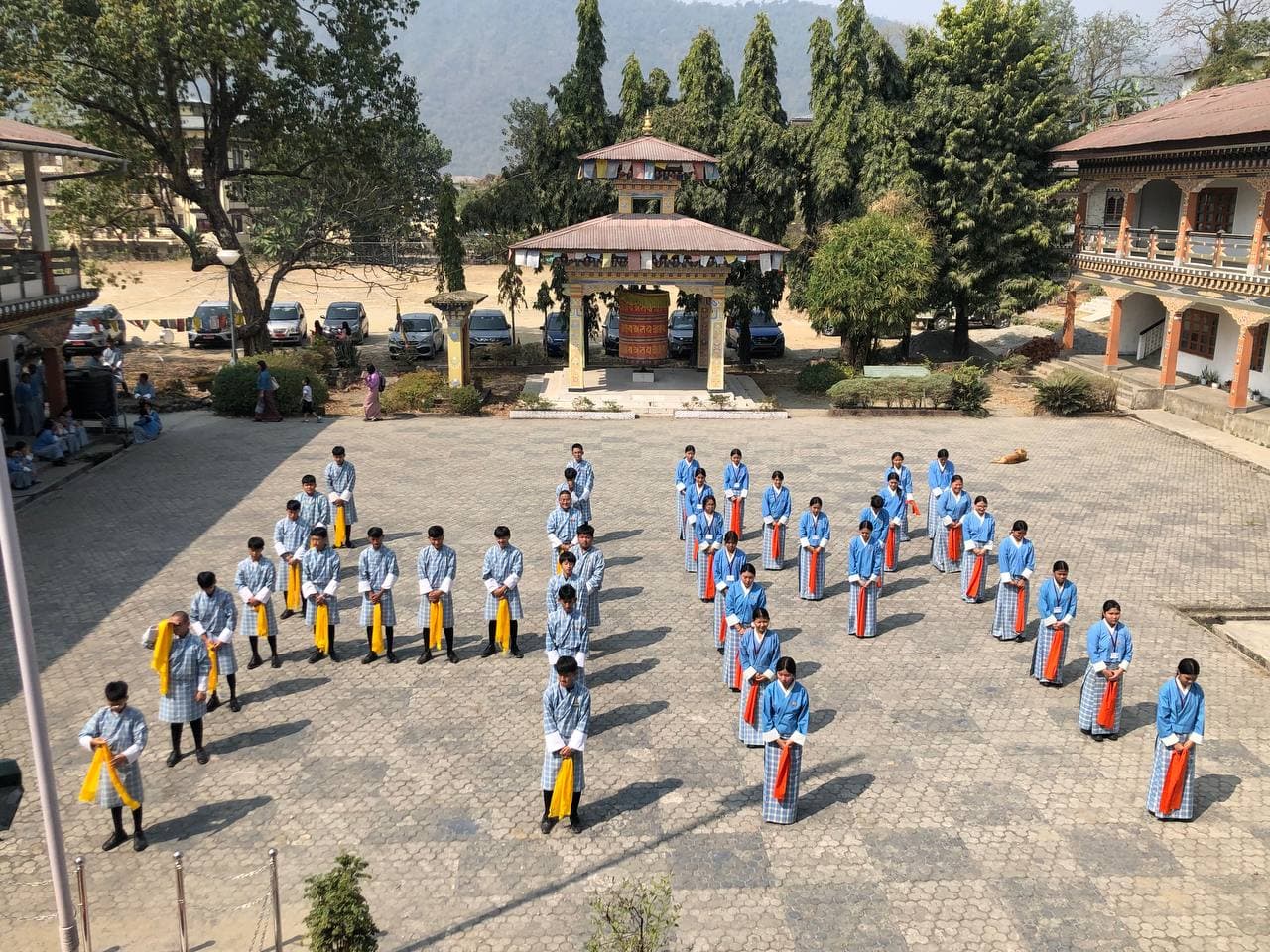 Students performing a cultural dance during His Majesty the King's birthday celebrations at PHSS